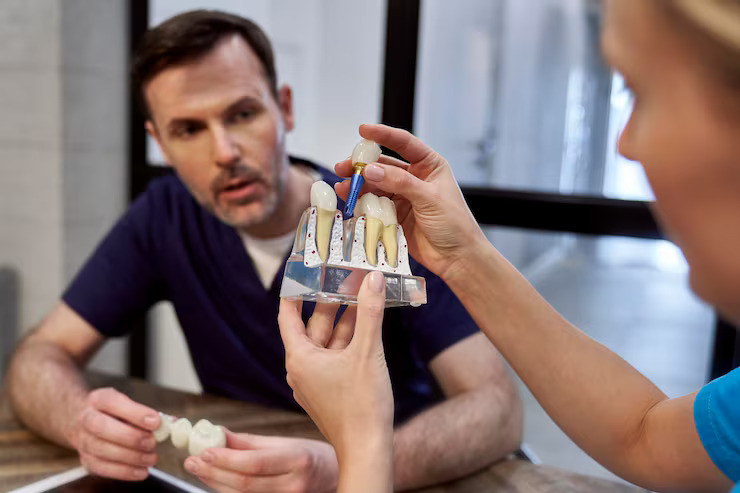 Dentist explaining dental implants